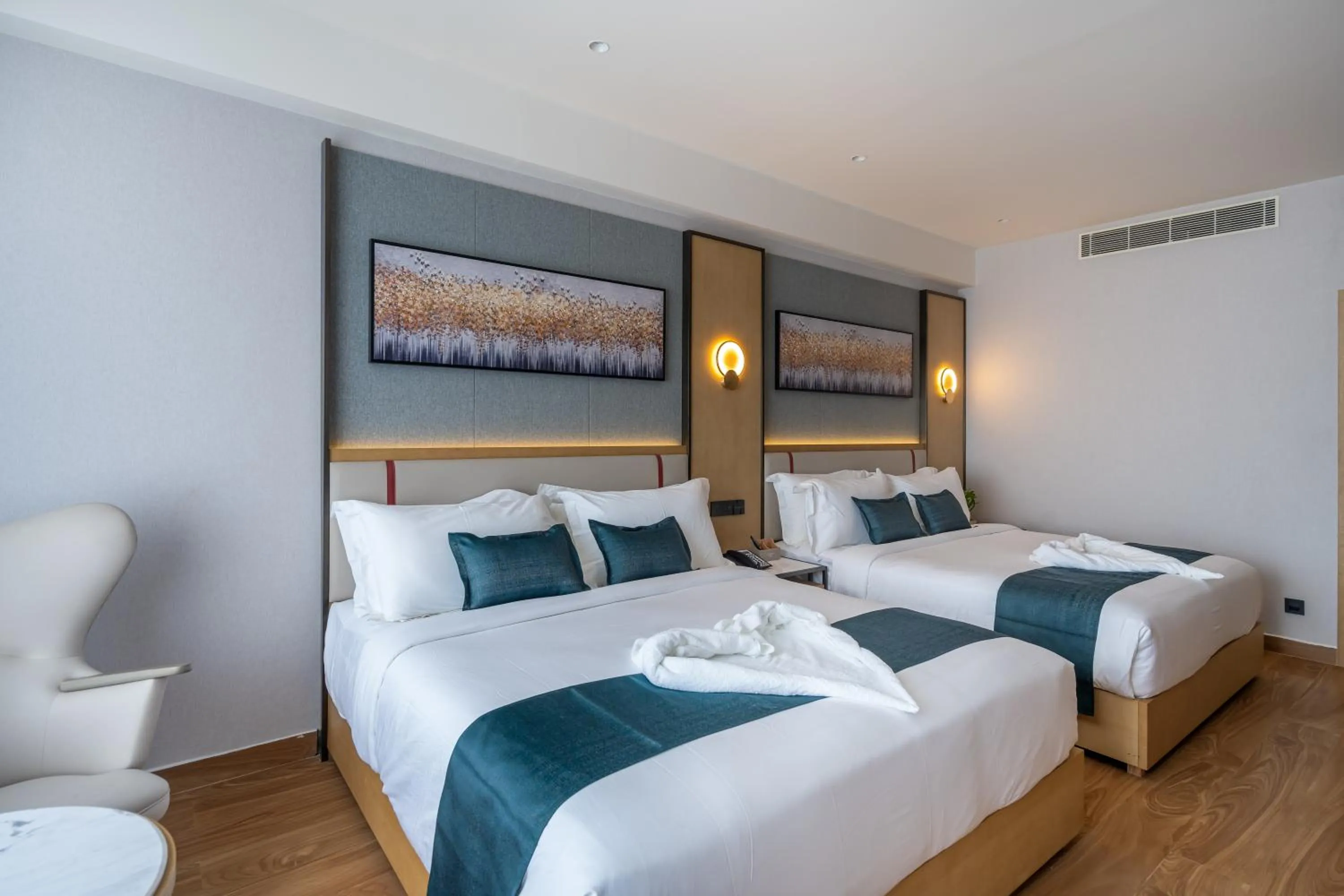 Bed in Copper Leaf Hotels, Tirunelveli