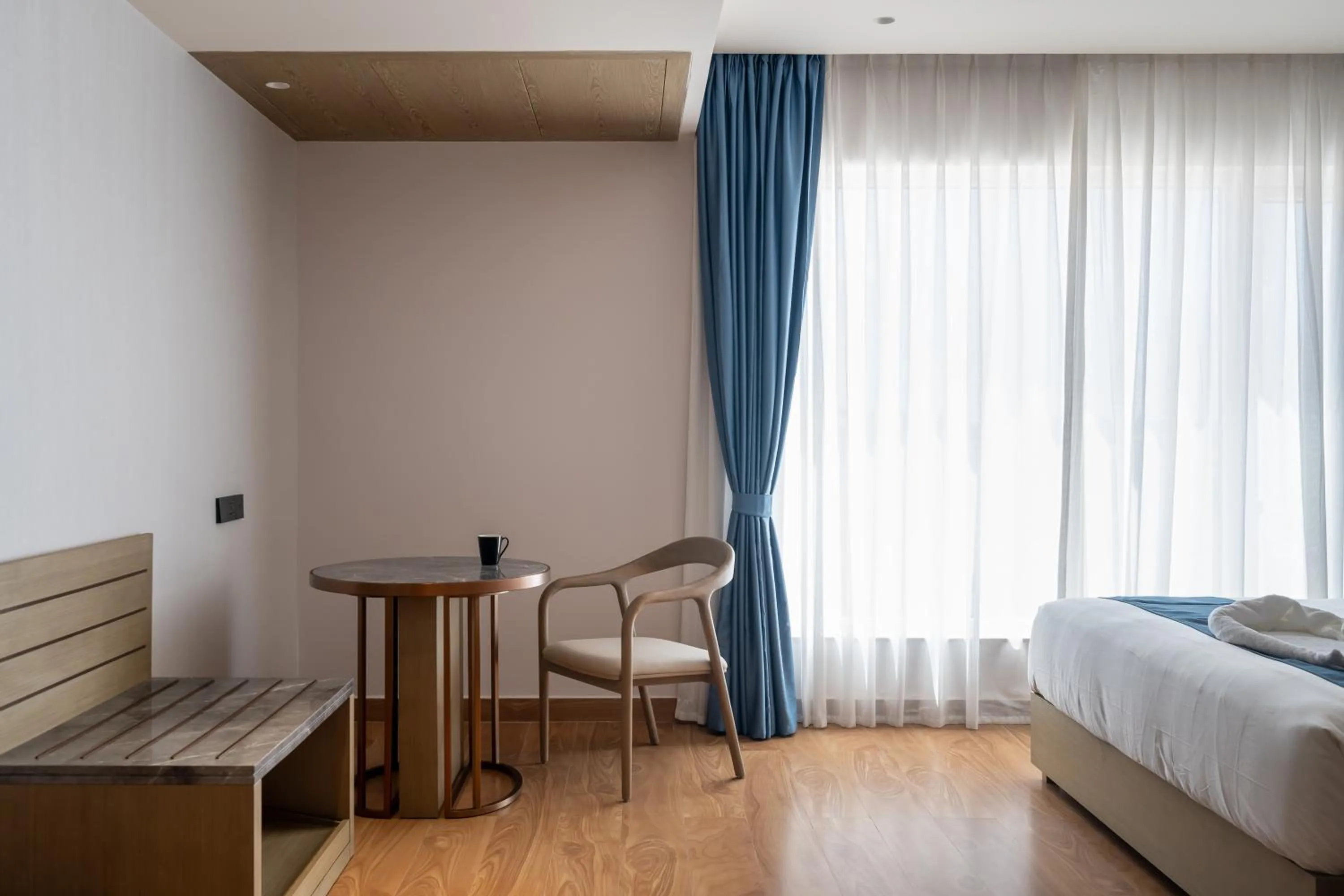 Seating area, Bed in Copper Leaf Hotels, Tirunelveli