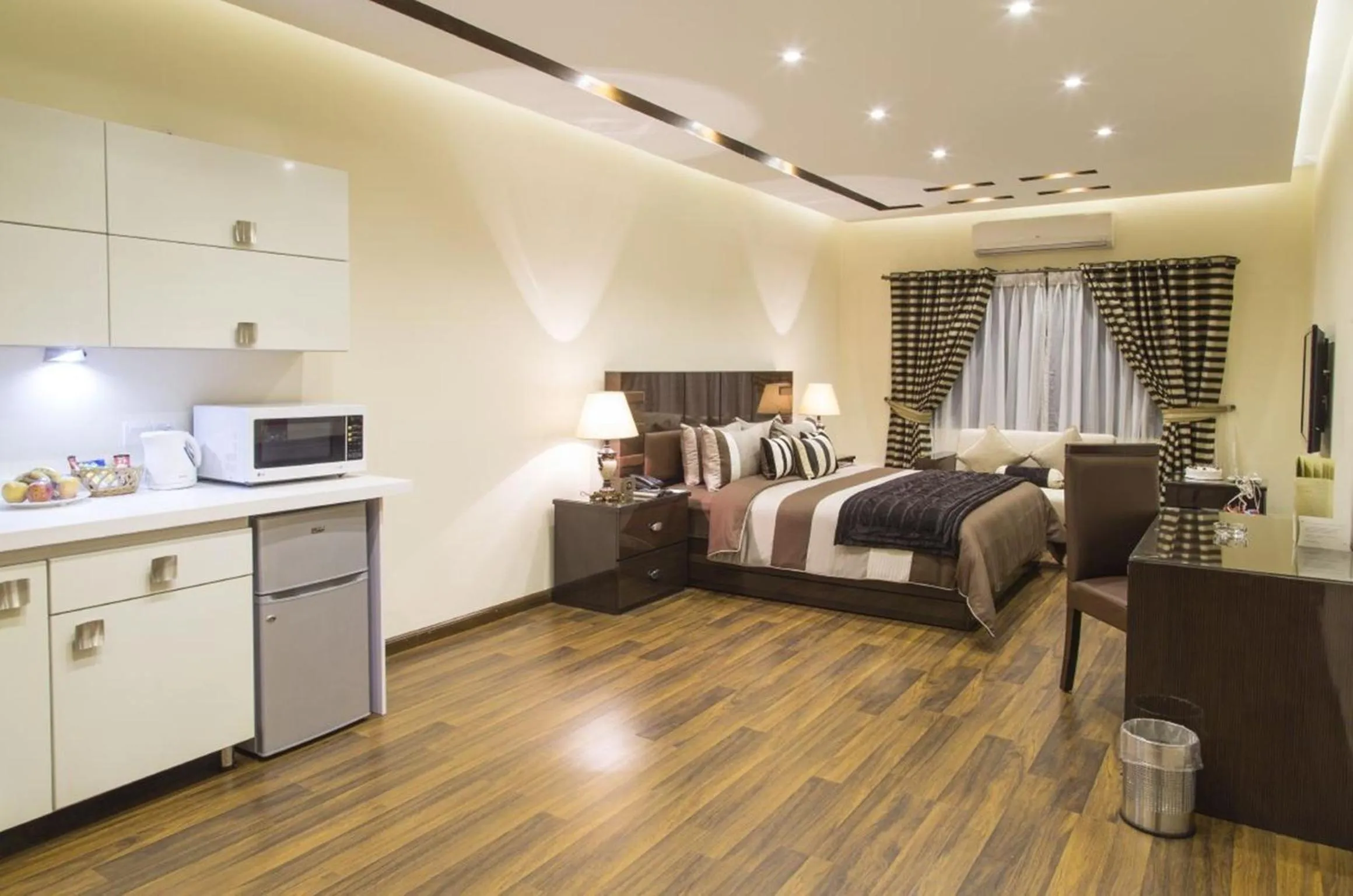 Kitchen or kitchenette, Bed in Royaute Luxury Suites and Hotel Gulberg Lahore
