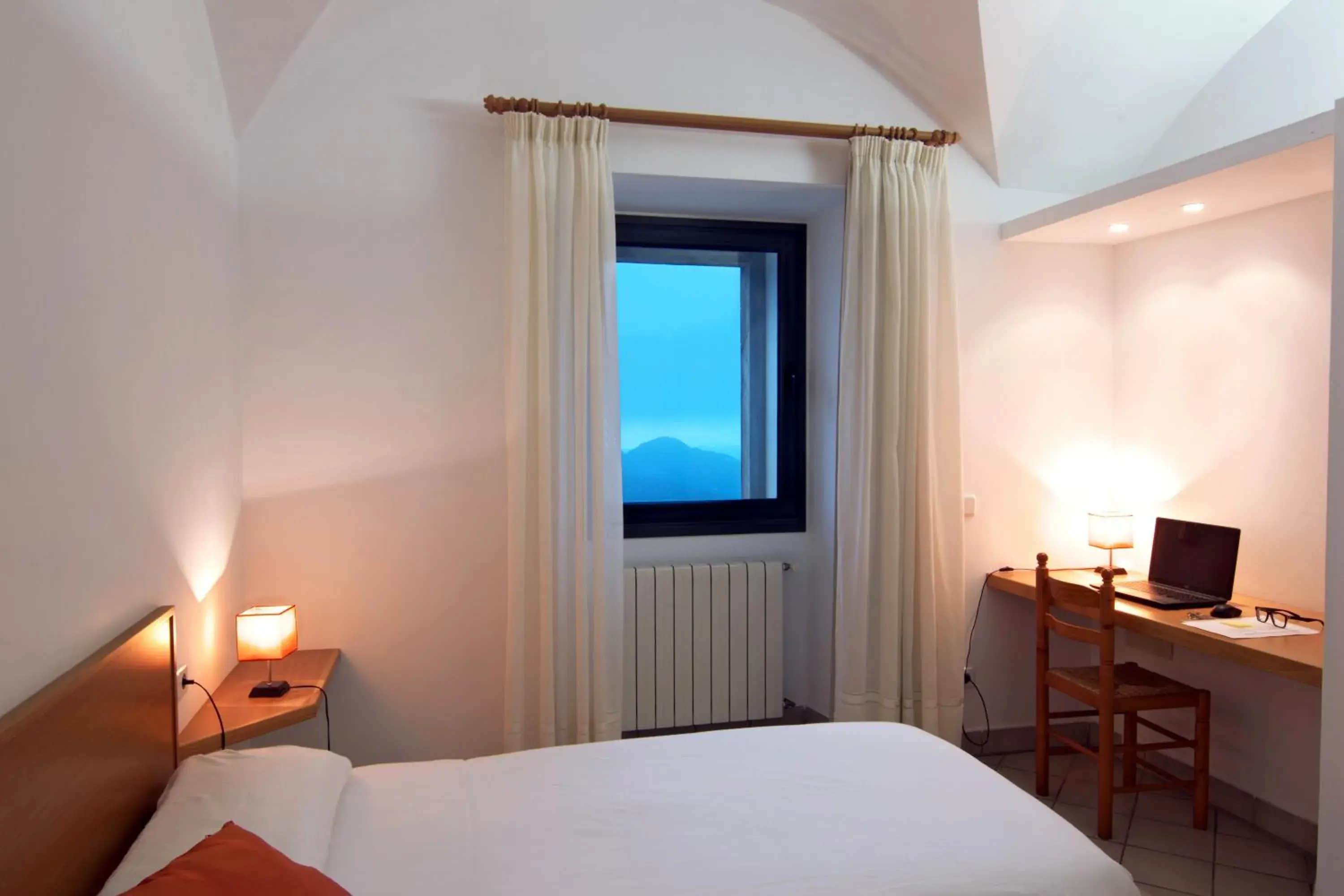 Photo of the whole room, Bed in Petit Hotel Hostatgeria Sant Salvador Photo of the whole room, Bed in Petit Hotel Hostatgeria Sant Salvador