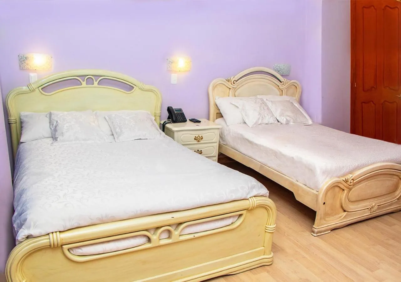 Bed in Hotel Boutique Casa Ruth en Cuenca