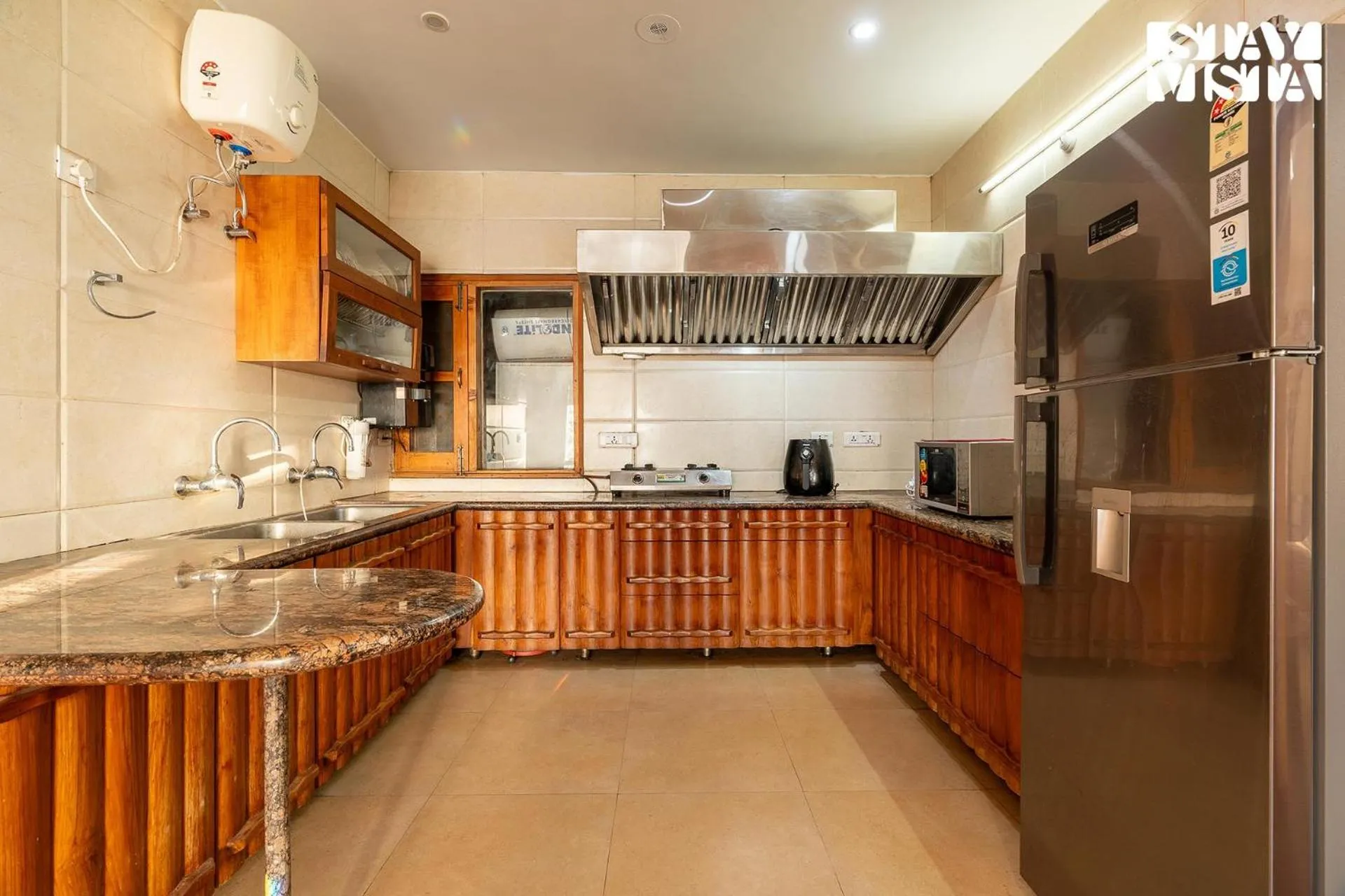 kitchen in StayVista at The Rustic Retreat - 4BHK Valley View villa with Lawn, Bonfire