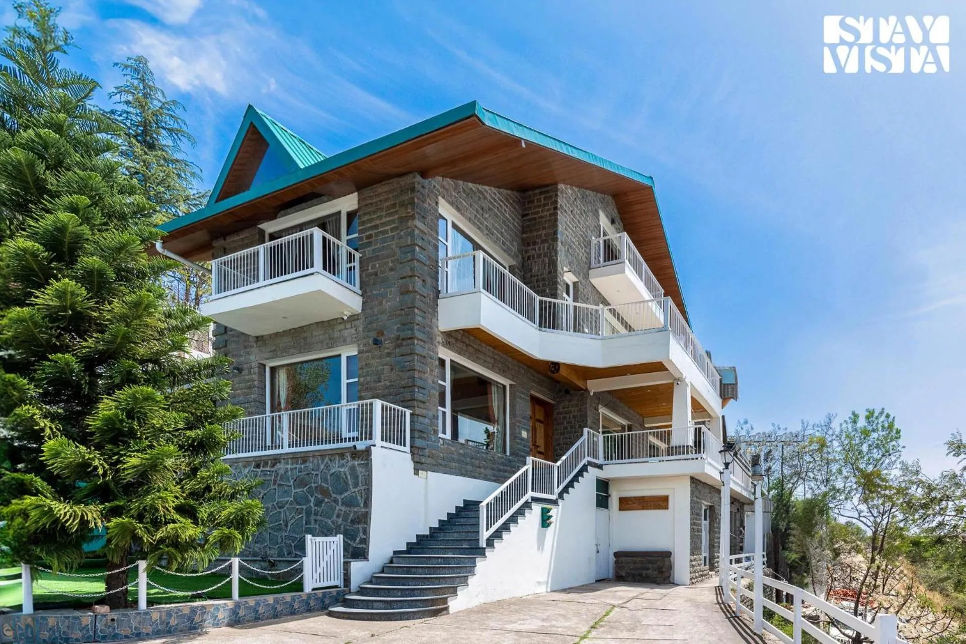 Property building in StayVista at The Rustic Retreat - 4BHK Valley View villa with Lawn, Bonfire