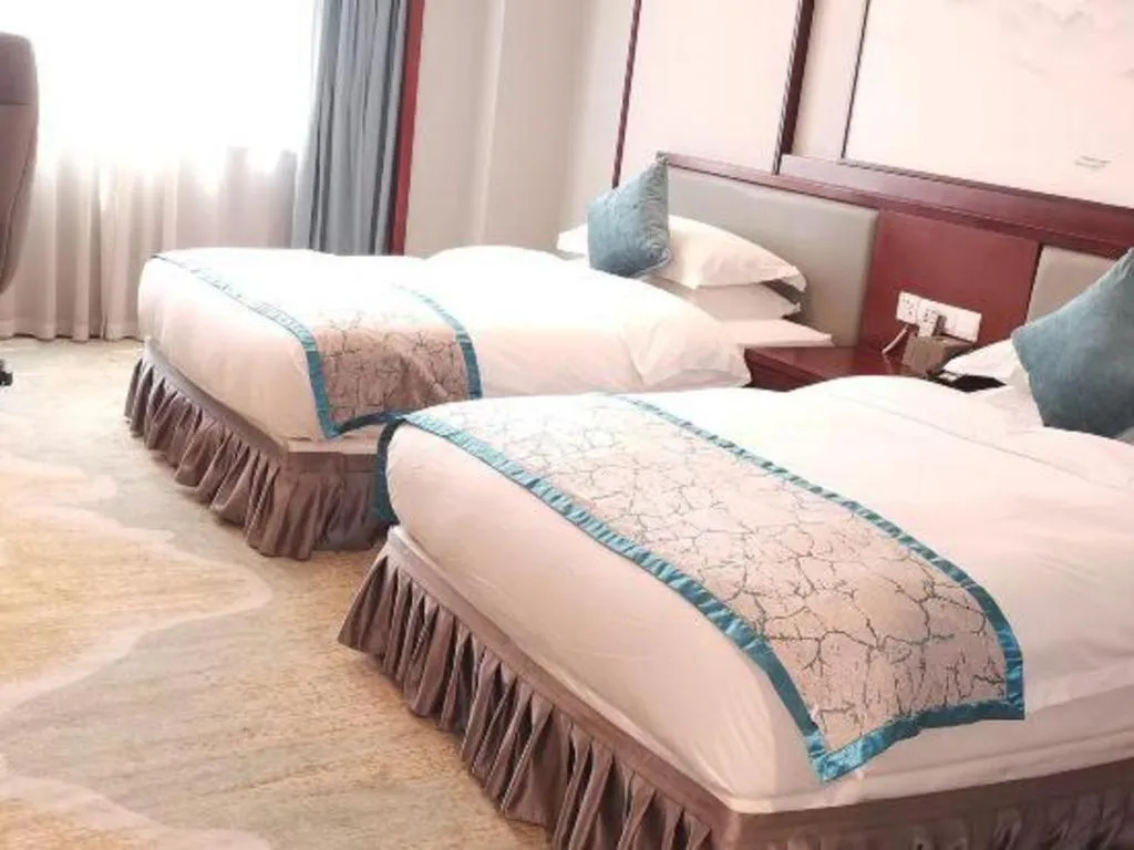 Bed in Yiyang Huatian Hotel