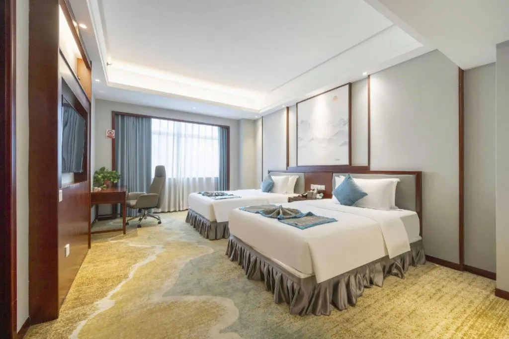 Bed in Yiyang Huatian Hotel
