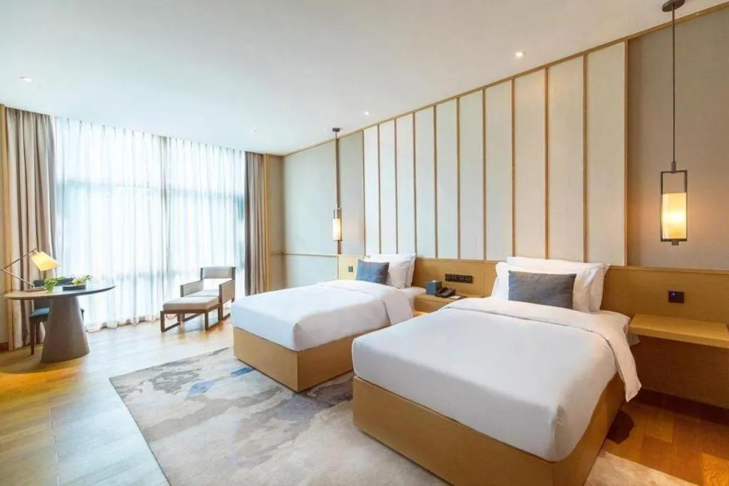 Bed in The Mulian Urban Resort Hotels Huadu