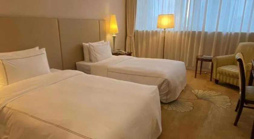 Bed in Jianguo Garden Hotel