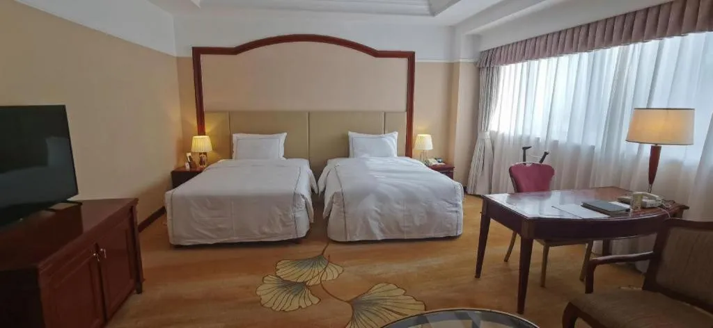 Bed in Jianguo Garden Hotel