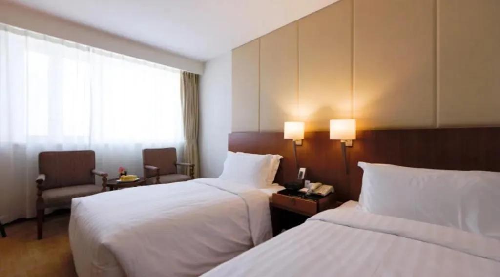 Bed in Jianguo Garden Hotel