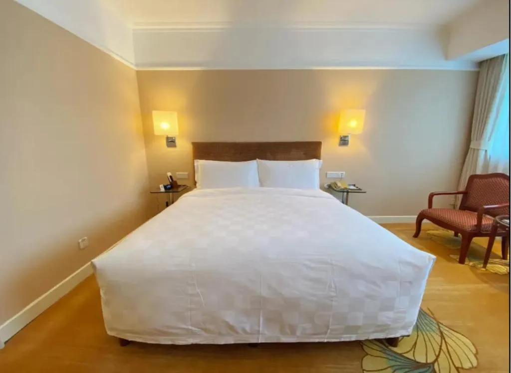 Bed in Jianguo Garden Hotel