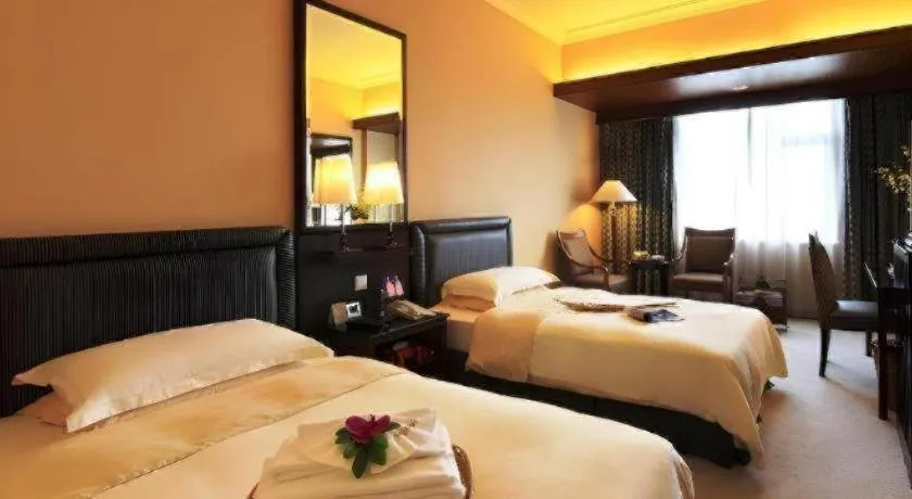 Bed in Seaview Gleetour Hotel Shenzhen Eastwing building