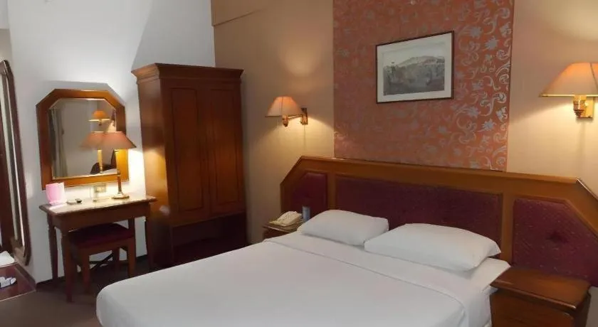 Bed in Puri Mega Hotel