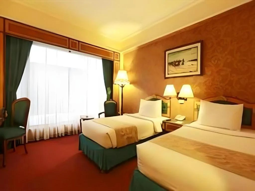 Bed in Gajahmada Graha Hotel