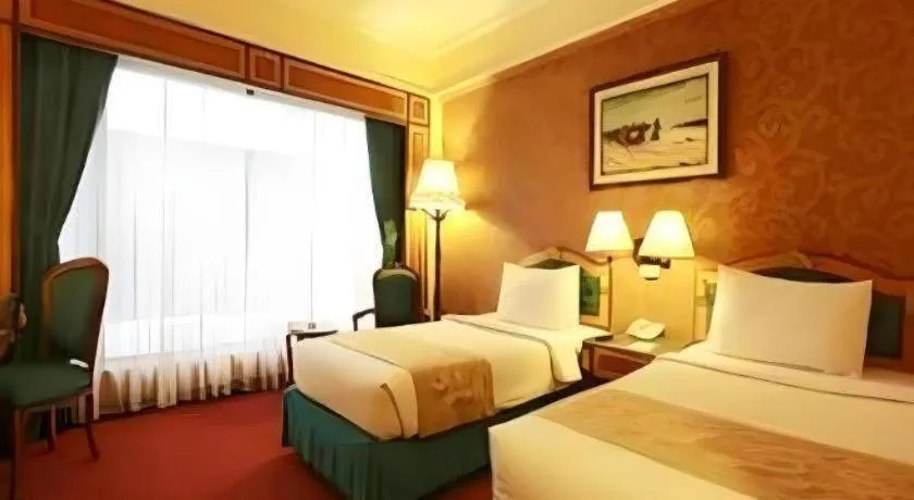 Bed in Gajahmada Graha Hotel