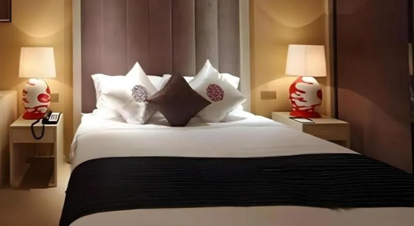 Bed in Yihe Grand Hotel