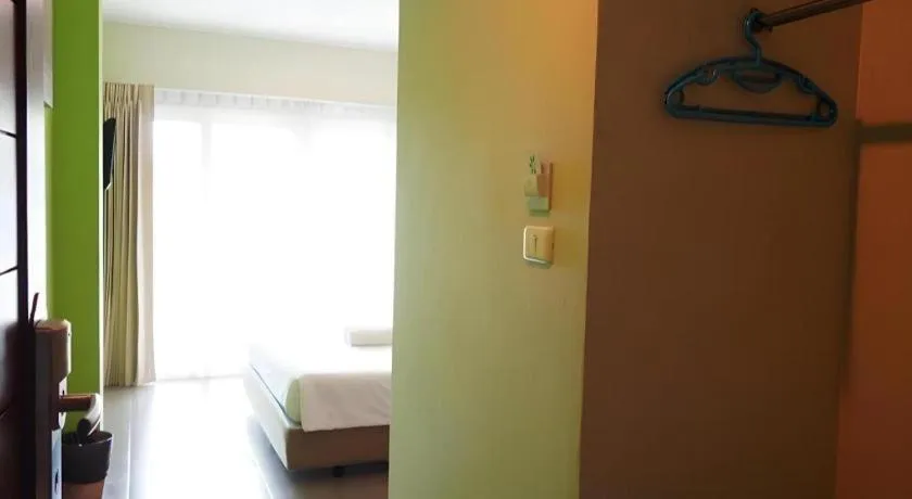 Bed in Phuket Ecozy Hotel