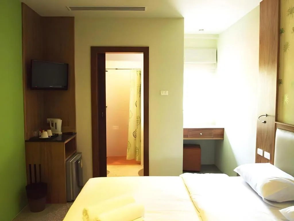 Bed in Phuket Ecozy Hotel