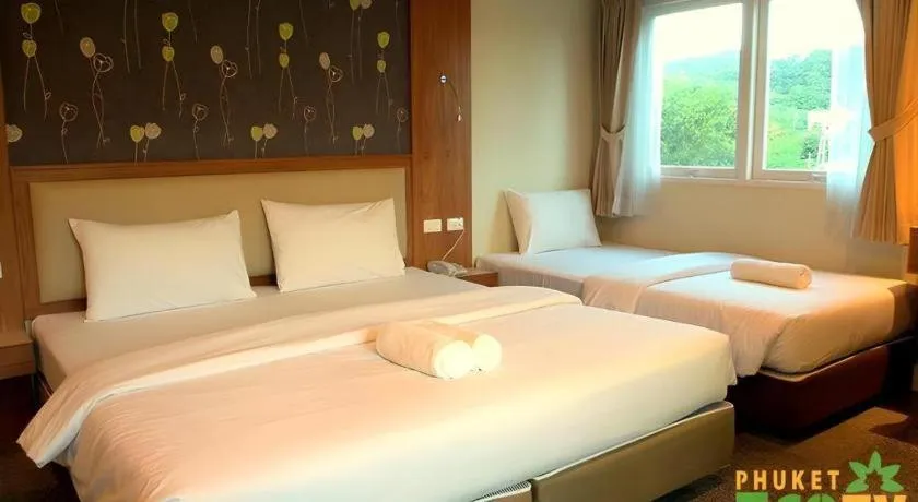 Bed in Phuket Ecozy Hotel