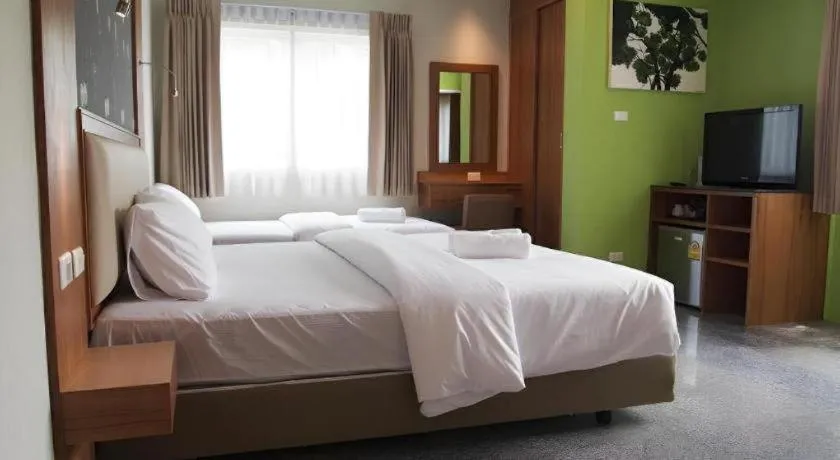 Bed in Phuket Ecozy Hotel