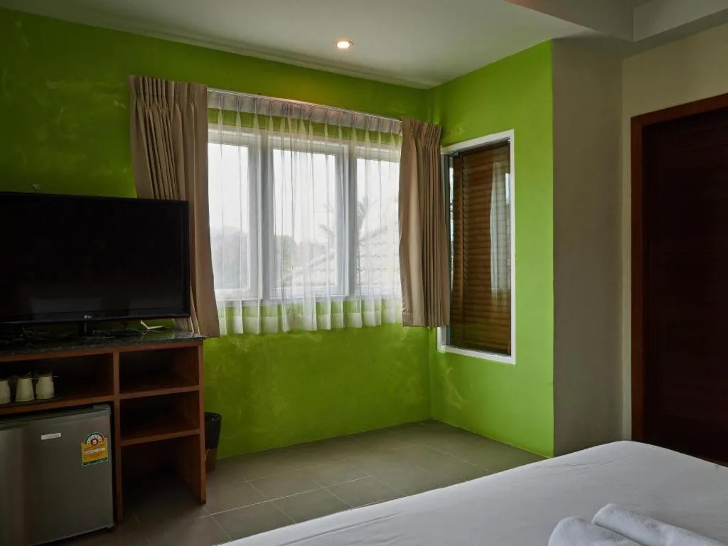 Bed in Phuket Ecozy Hotel