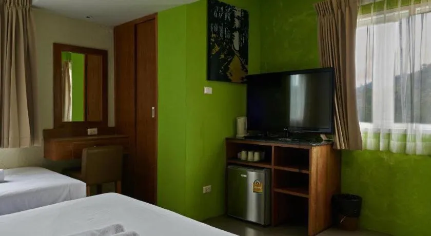 Bed in Phuket Ecozy Hotel