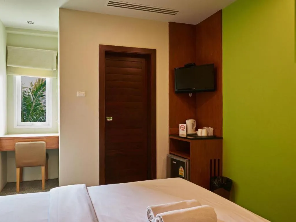 Bed in Phuket Ecozy Hotel