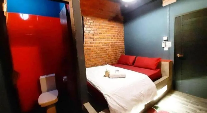 Bed in The Royal Chiangkhan Boutique Hotel