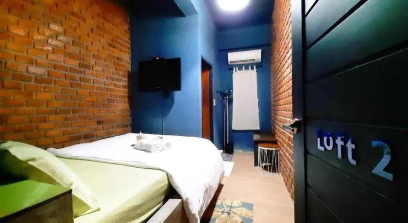 Bed in The Royal Chiangkhan Boutique Hotel