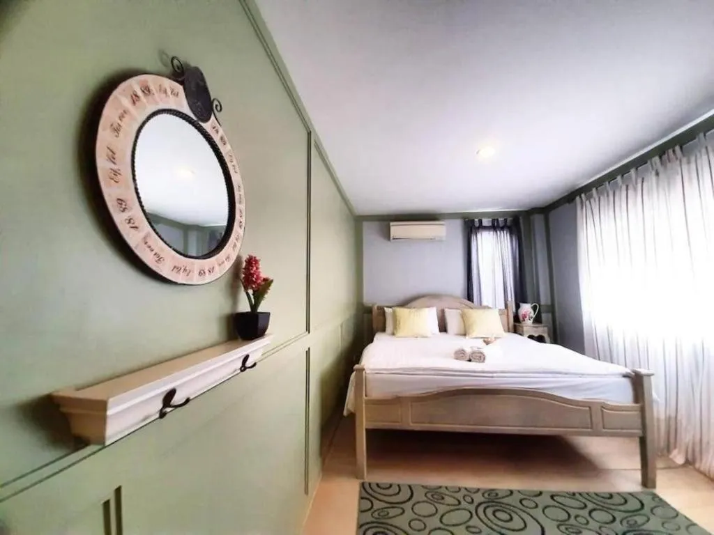 Bed in The Royal Chiangkhan Boutique Hotel