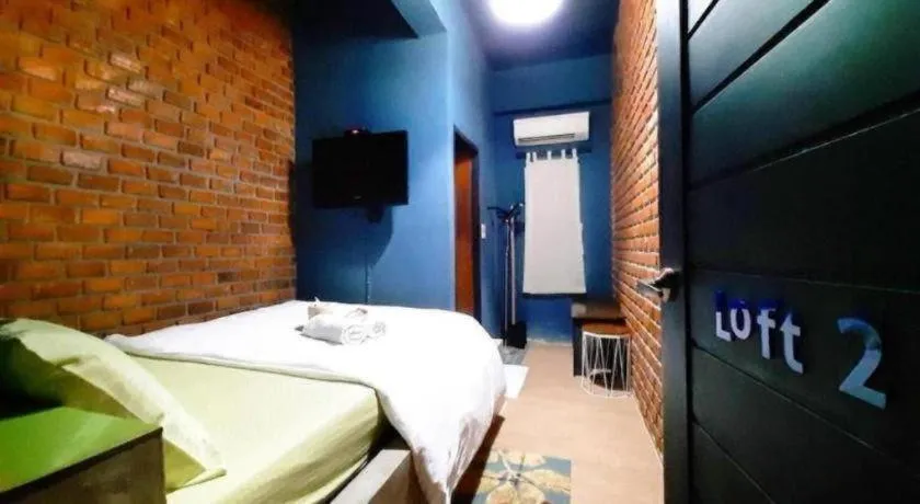 Bed in The Royal Chiangkhan Boutique Hotel