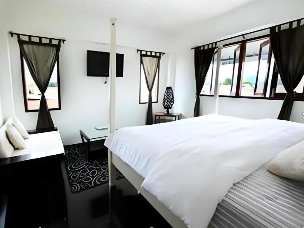 Bed in The Royal Chiangkhan Boutique Hotel