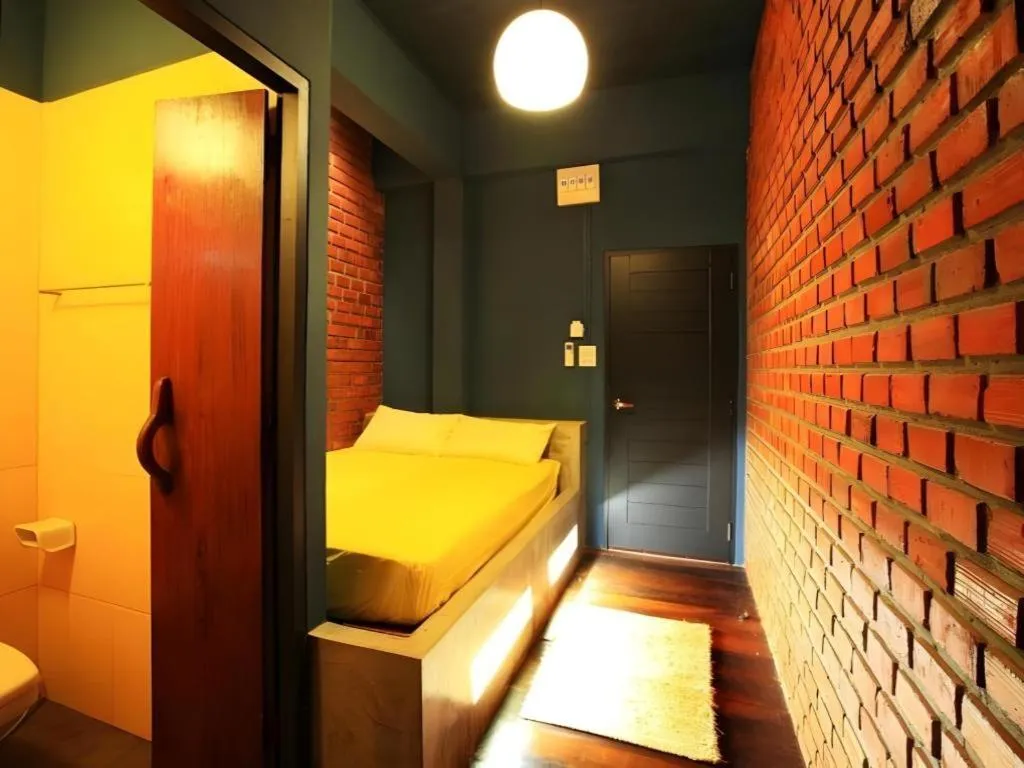 Bed in The Royal Chiangkhan Boutique Hotel