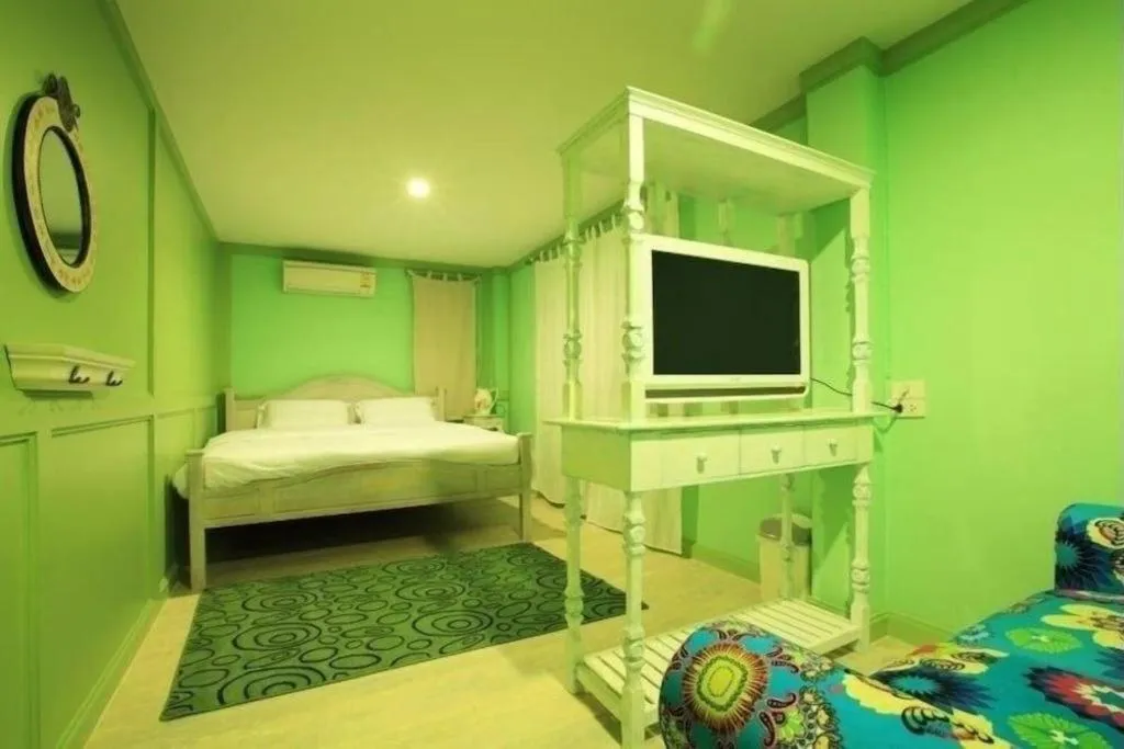 Bed in The Royal Chiangkhan Boutique Hotel