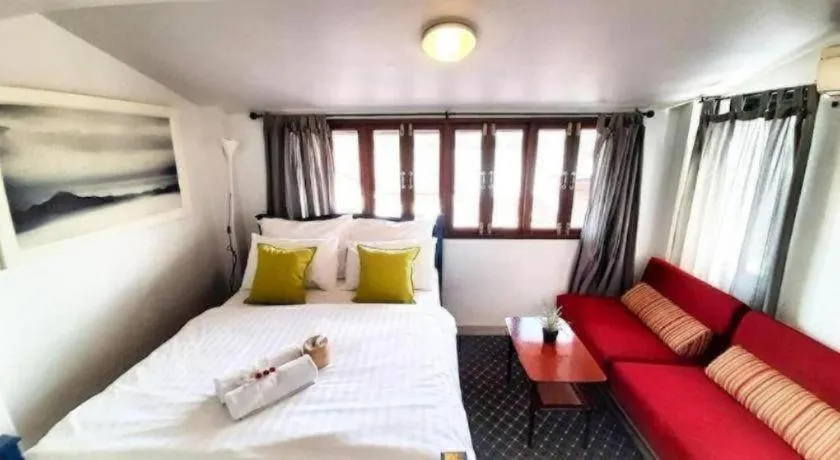 Bed in The Royal Chiangkhan Boutique Hotel