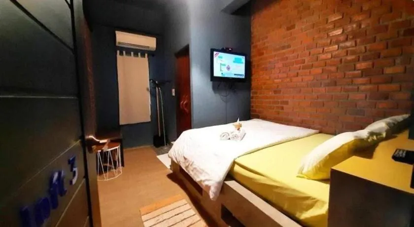 Bed in The Royal Chiangkhan Boutique Hotel