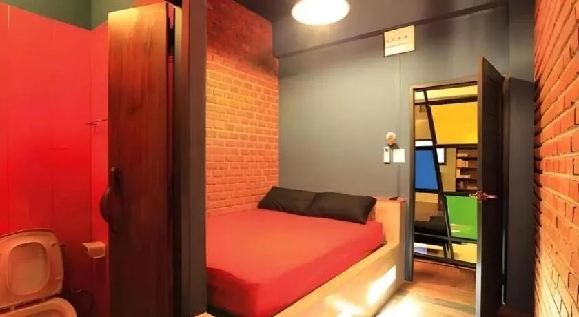 Bed in The Royal Chiangkhan Boutique Hotel