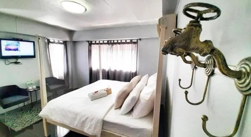 Bed in The Royal Chiangkhan Boutique Hotel