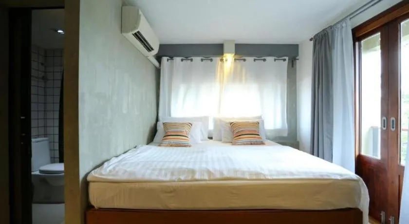 Bed in Chic Chiangkhan Hotel