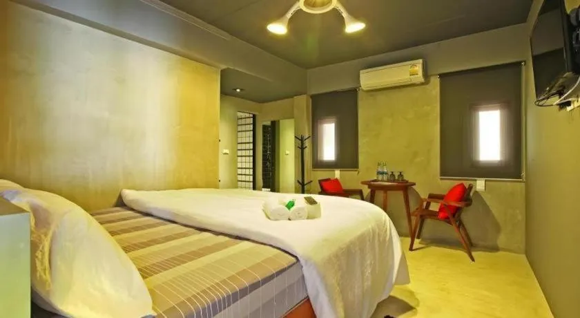 Bed in Chic Chiangkhan Hotel