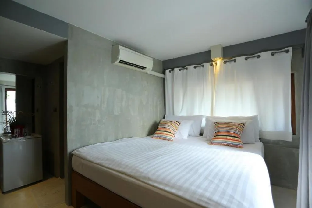 Bed in Chic Chiangkhan Hotel