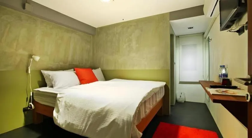 Bed in Chic Chiangkhan Hotel