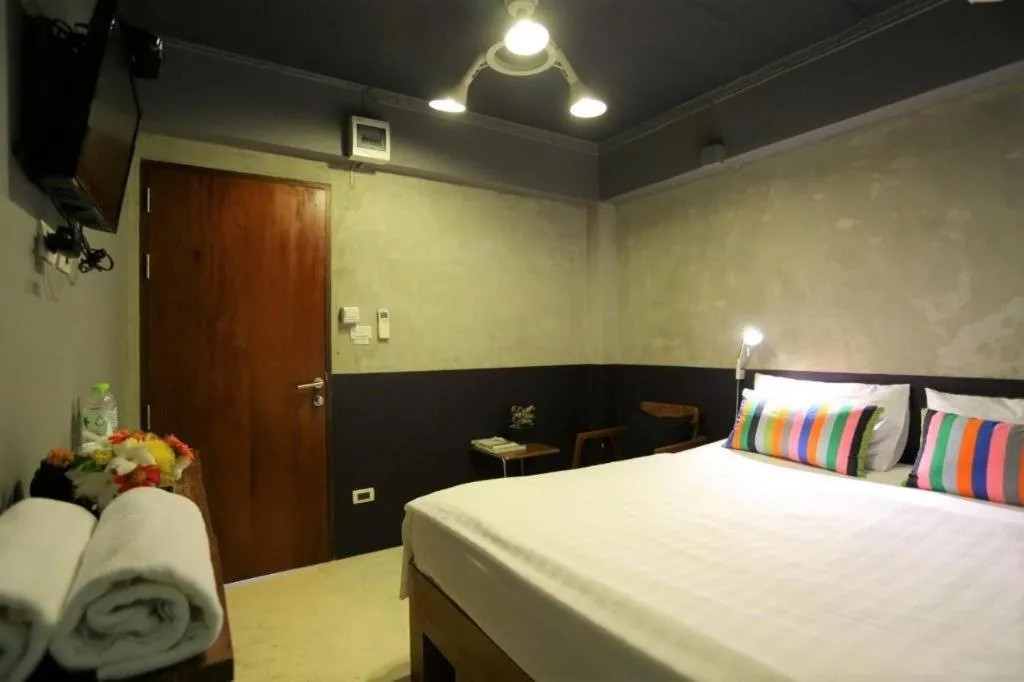 Bed in Chic Chiangkhan Hotel