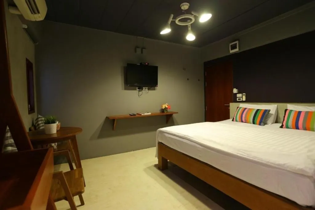 Bed in Chic Chiangkhan Hotel