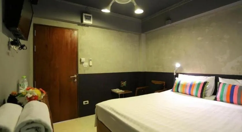 Bed in Chic Chiangkhan Hotel