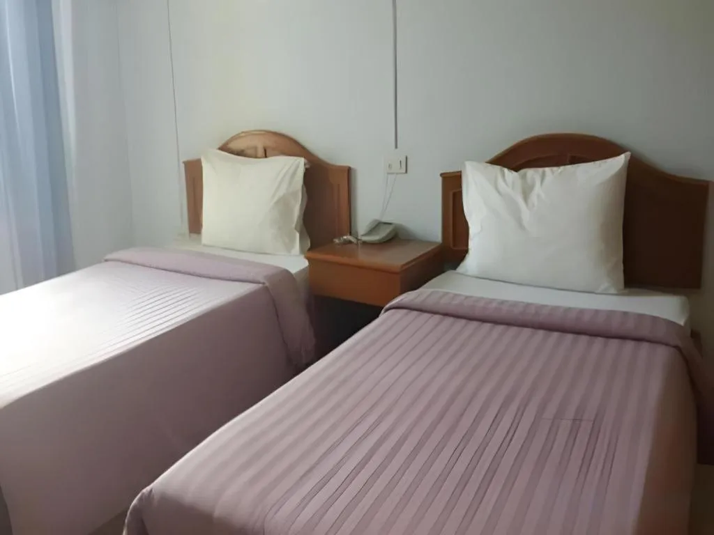 Bed in Ritzy House Hotel