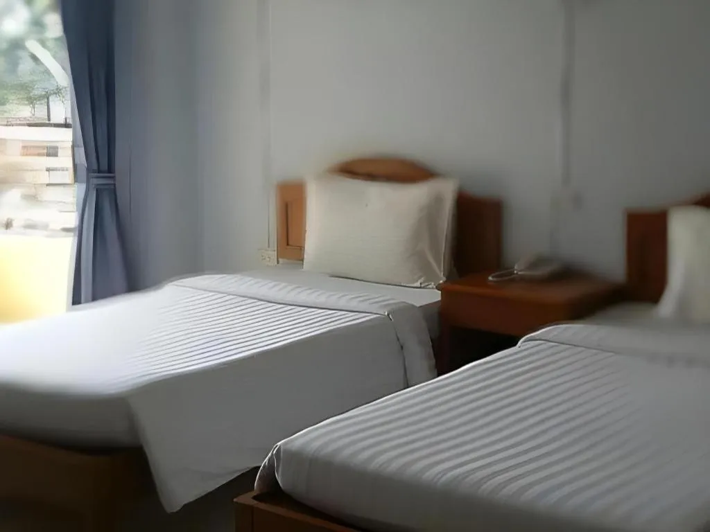 Bed in Ritzy House Hotel