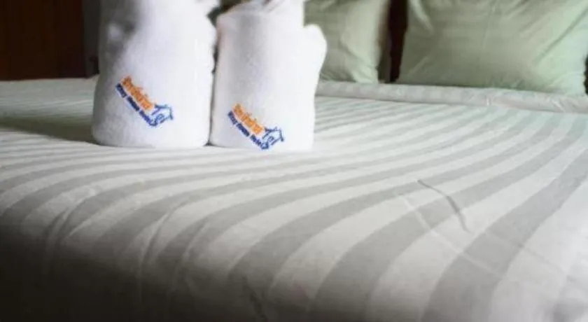 Bed in Ritzy House Hotel