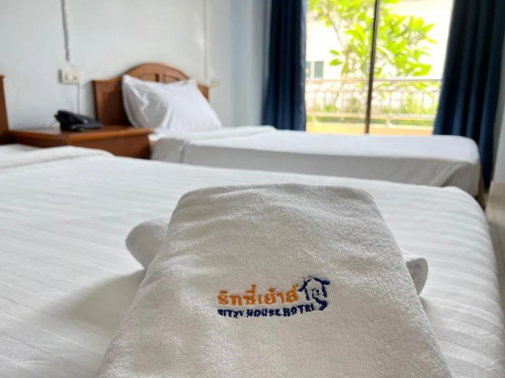 Bed in Ritzy House Hotel