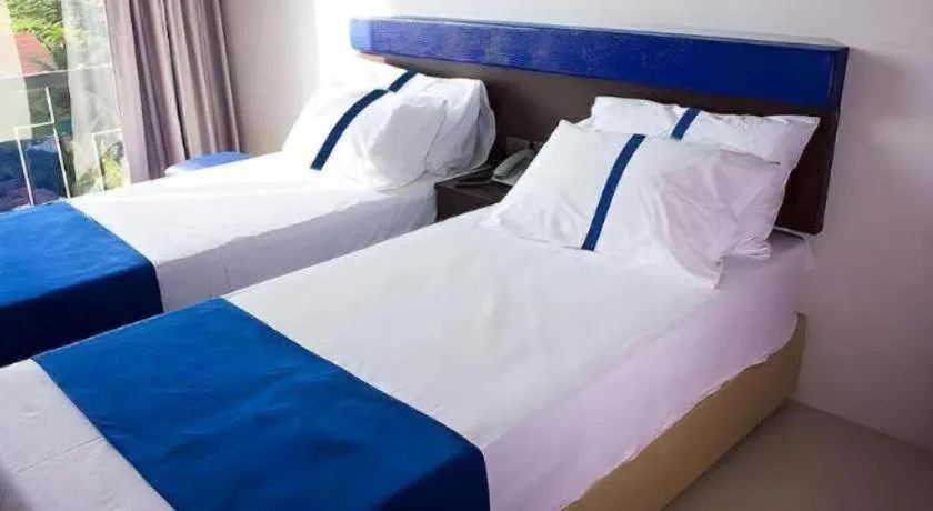 Bed in Ingtara Hotel