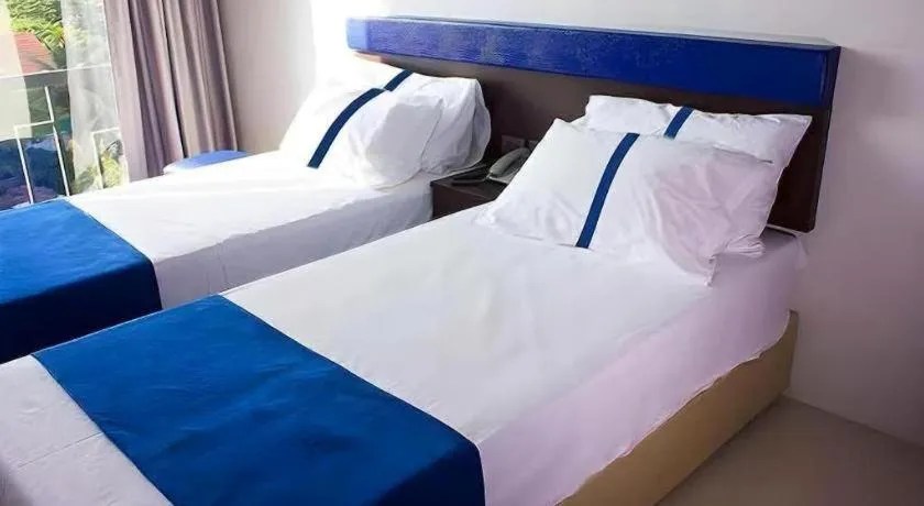 Bed in Ingtara Hotel